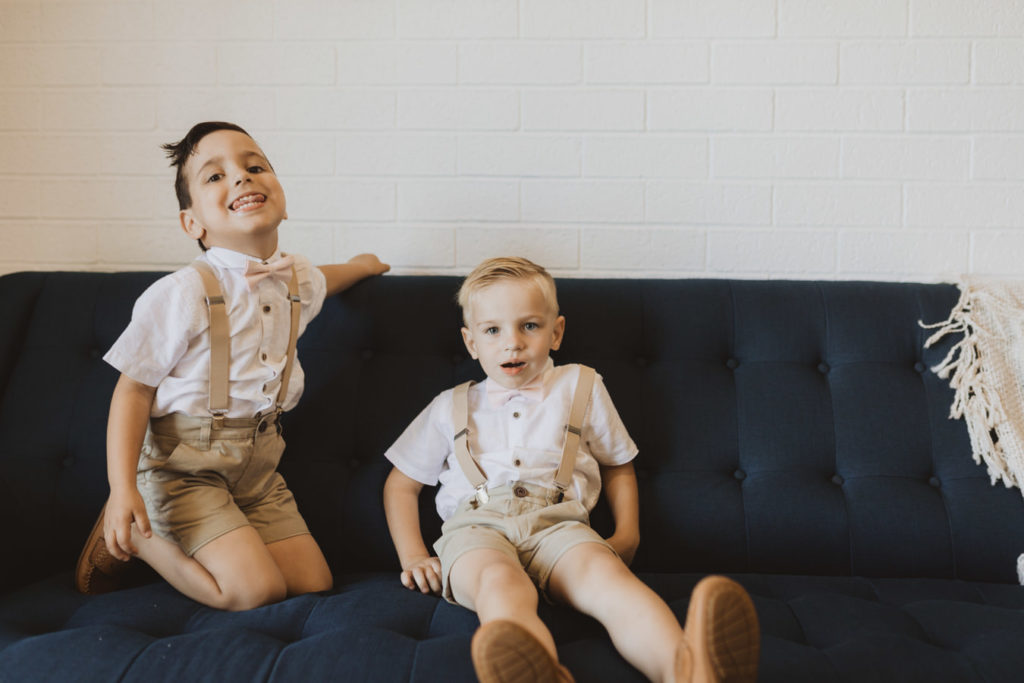 ring bearers in suspenders and bowtie