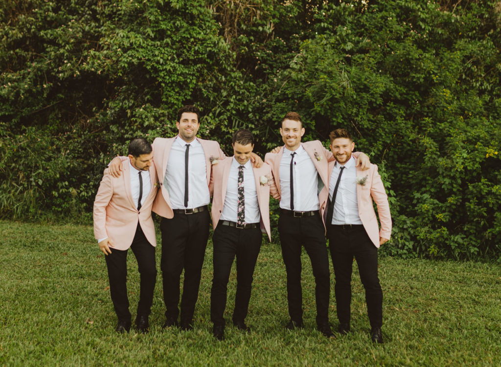 groomsmen in pink suits