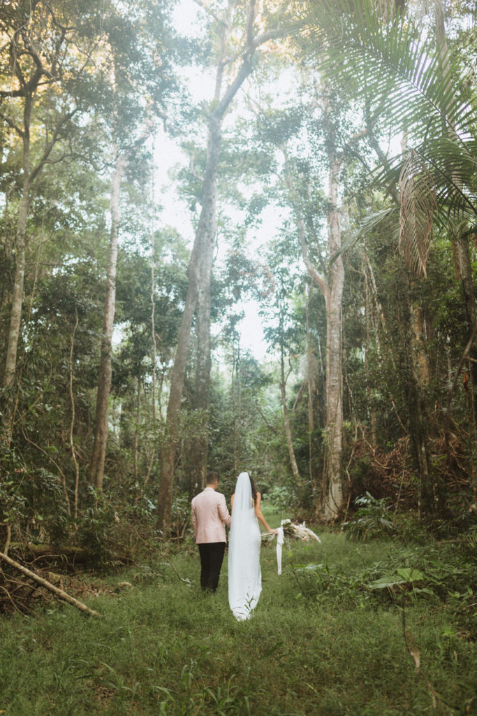 bride and groom portraits in rainforest
