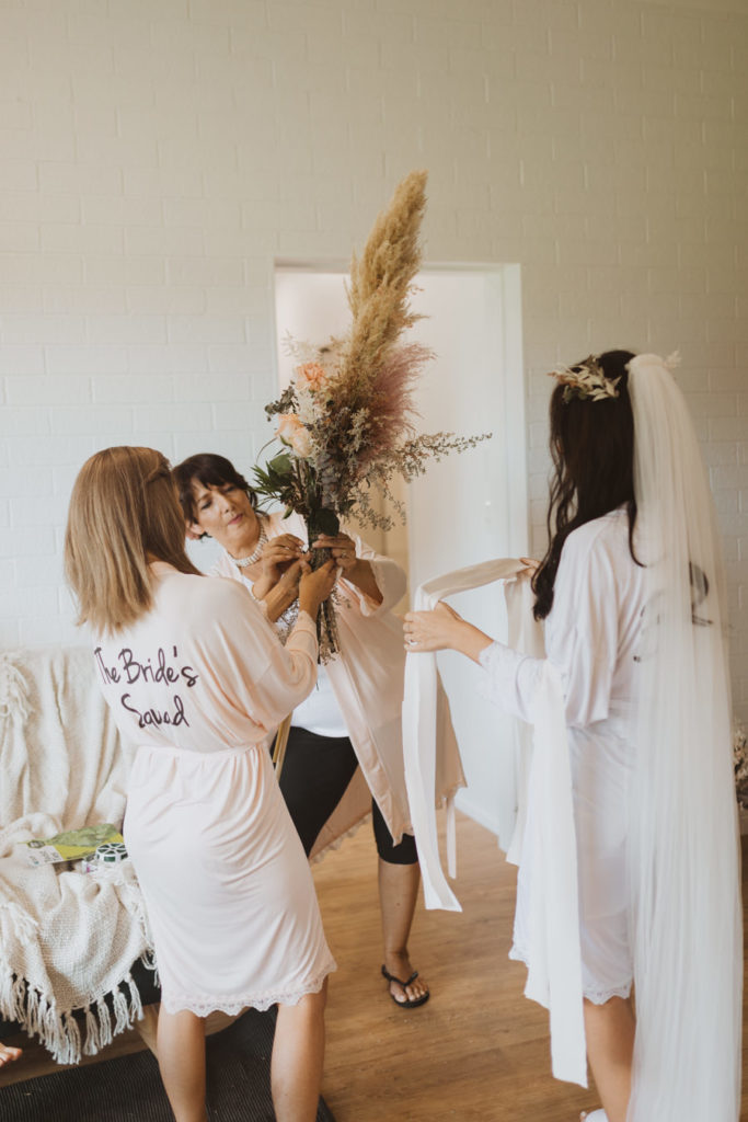 bride making her own bouquet