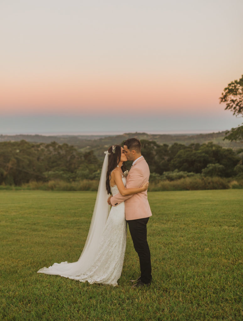 bride and groom portraits at sunset with cotton candy skies