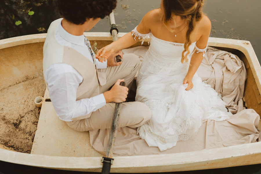 bride and groom elopement in rowboat