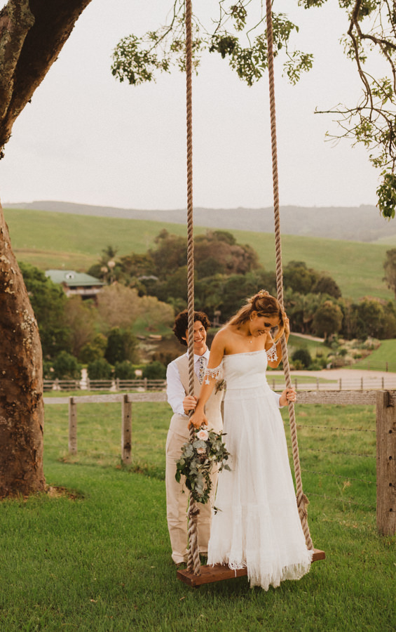 bride and groom on swing in Australia