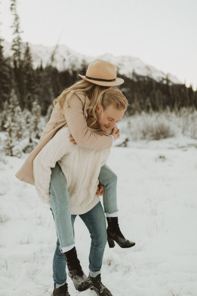 piggy back ride in the snowy mountains