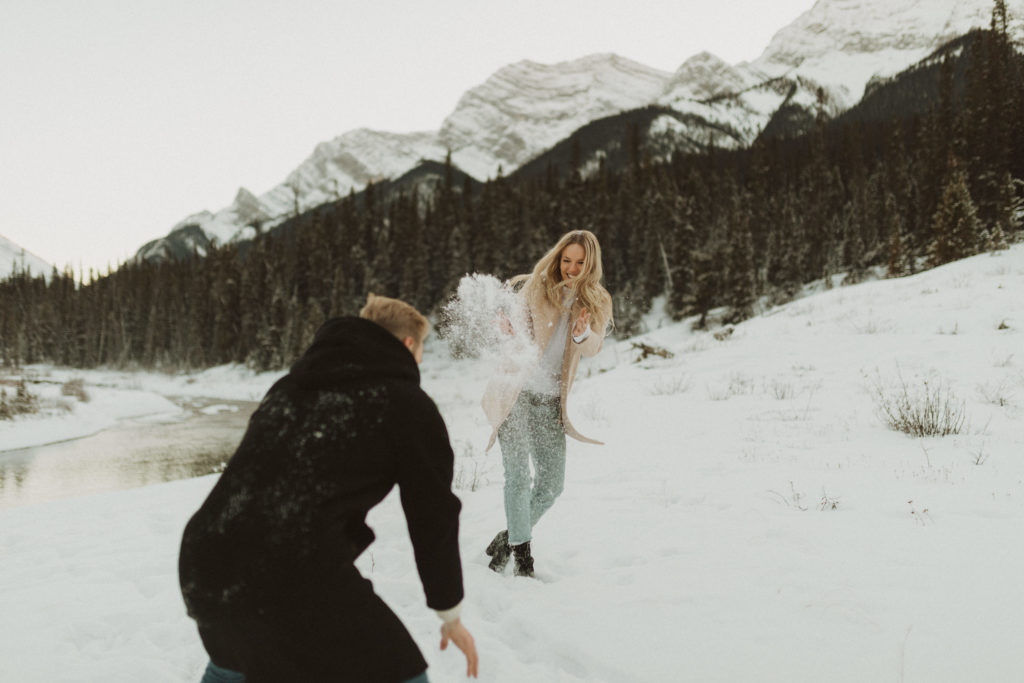 snowball fight picture during engagement shoot