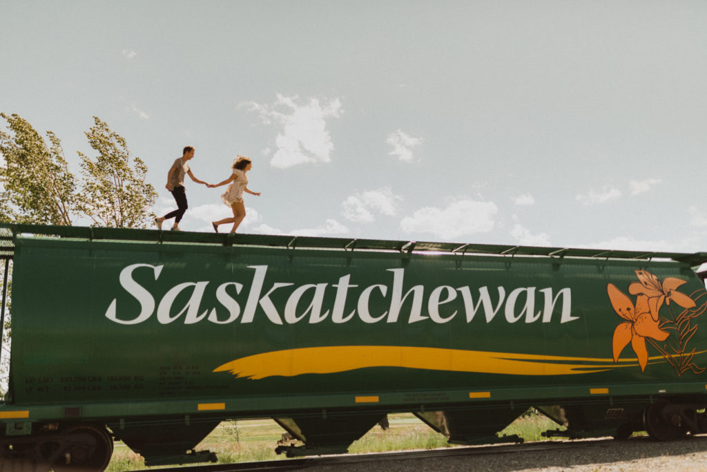 couple photography running on train in Saskatchewan