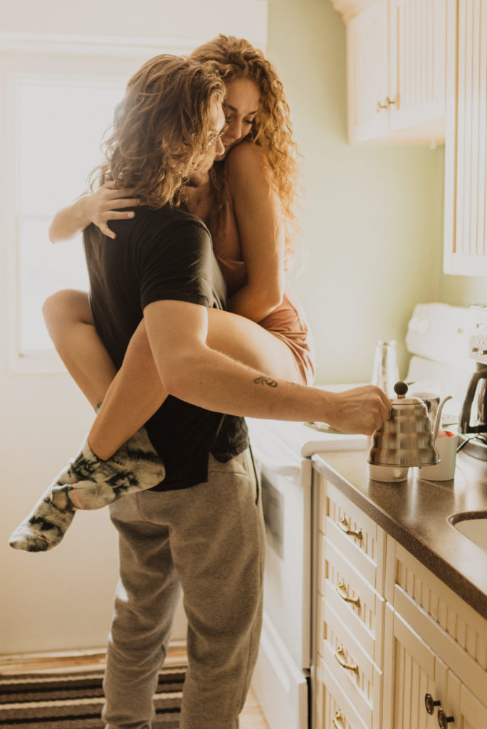 cozy in home couples photography session making coffee together