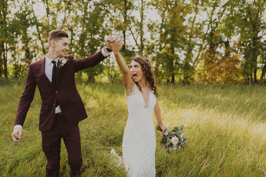 bride and groom swinging hands and walking, posing ideas