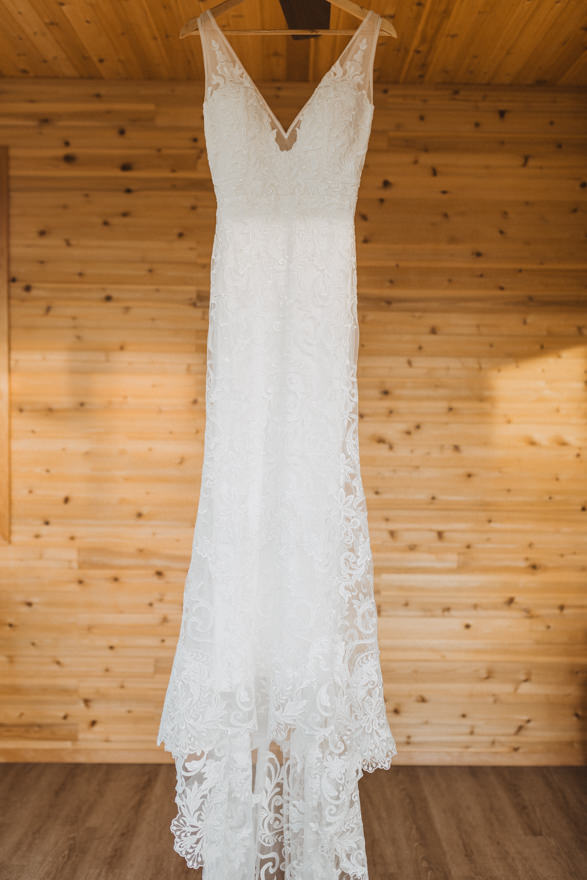 lace wedding dress hanging, wedding photographer