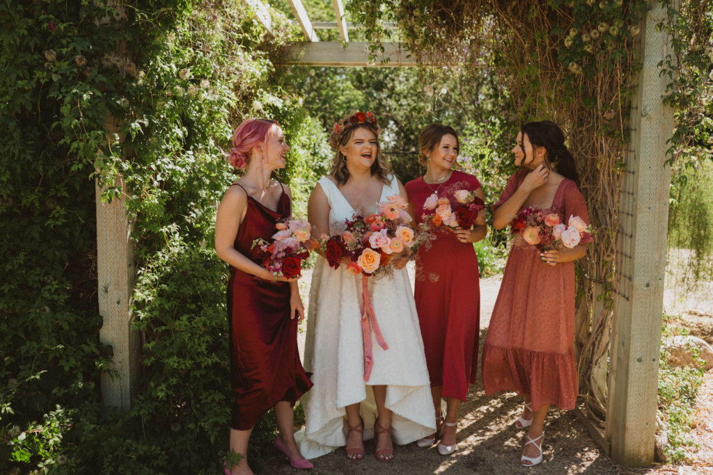 bridesmaids in pink mismatched dresses