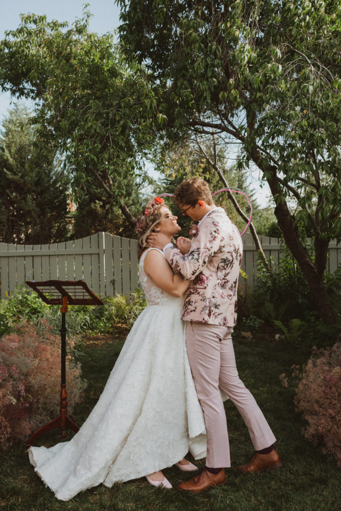 backyard wedding ceremony first kiss
