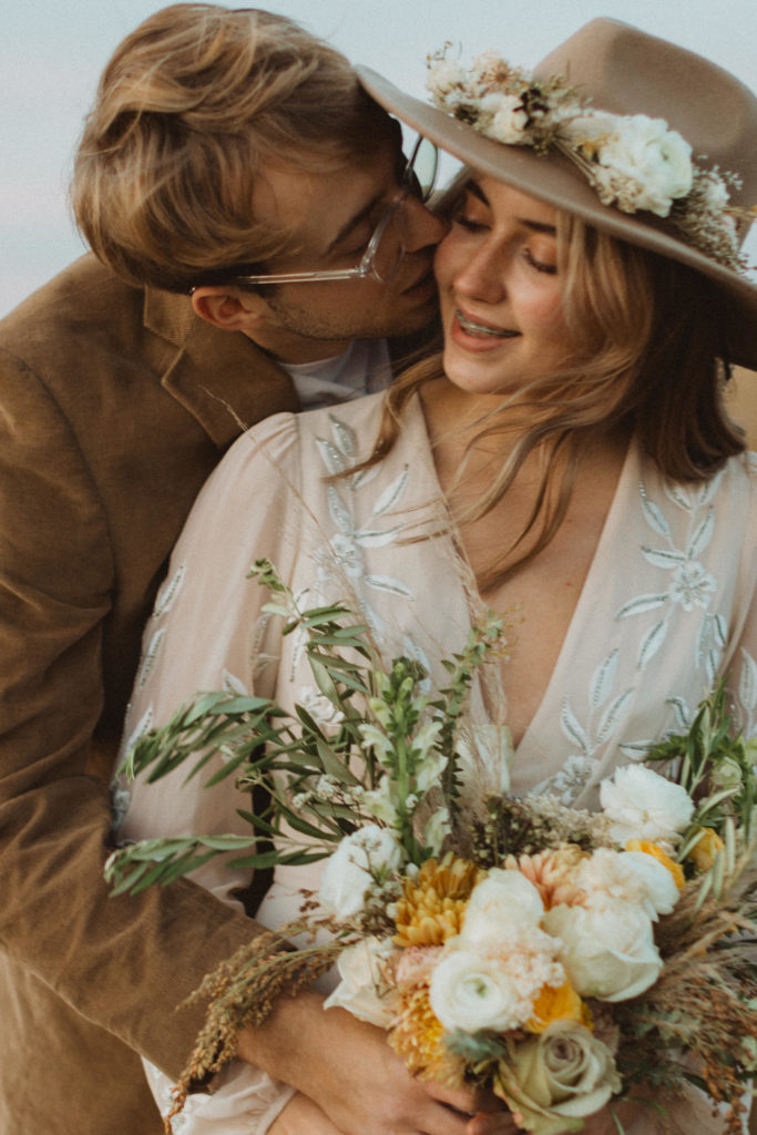 couple have a boho elopement just the two of them. Pros and Cons of eloping with family vs. eloping just you and your partner.