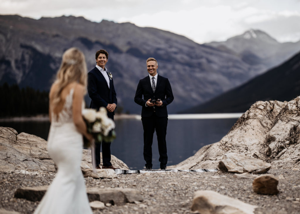 Urban Officiant is an Alberta elopement officiant and was chosen as one of Alberta's top elopement vendors. Seen officiating a mountain elopement with just the couple.