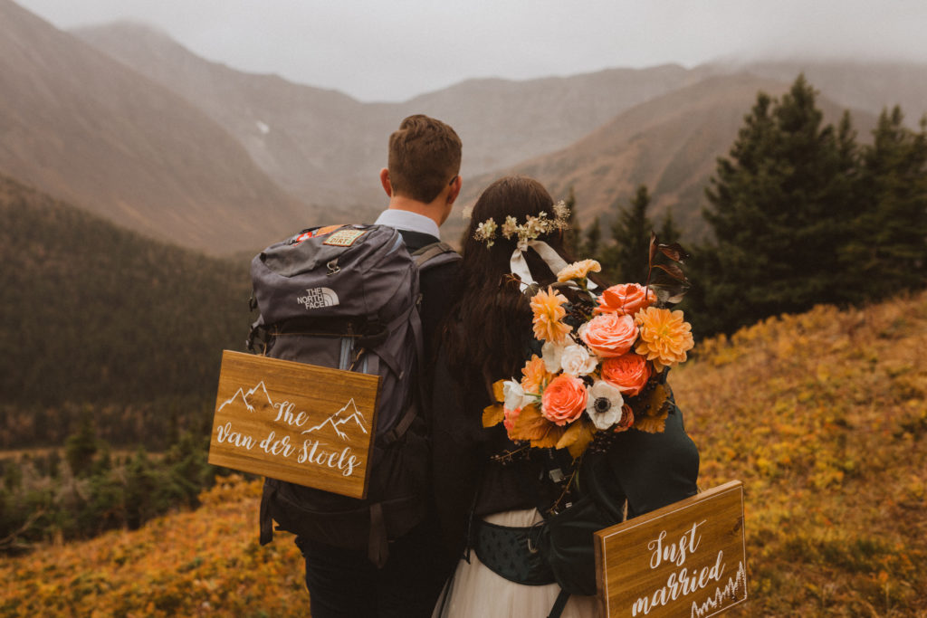 What does elope mean? It means making your wedding day about you and focused on what you want. This couple hiked a mountain and took in all the scenery on their elopement day.