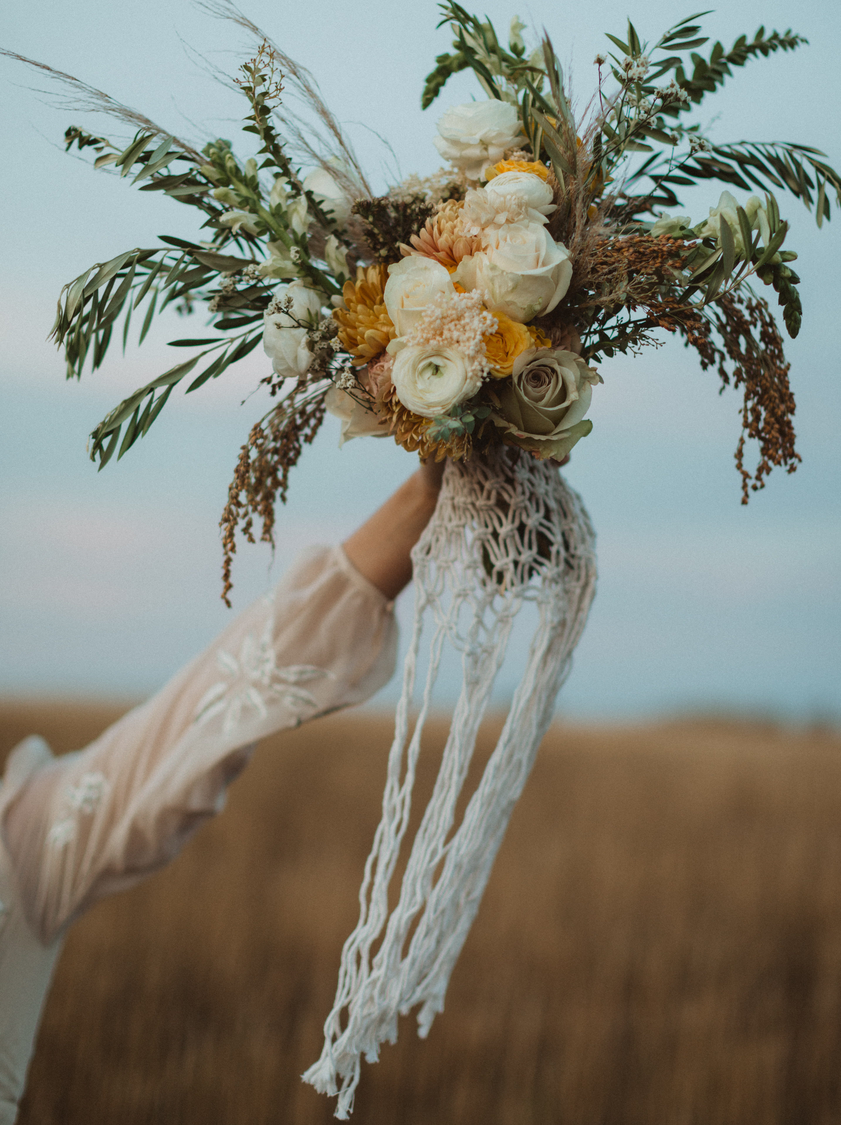 Crafty Liv created beautiful custom macrame pieces for elopements, bouquet wrap, plant hangers, and macrame hangings to hang on the trees and was chosen as one of Alberta's top elopement vendors.