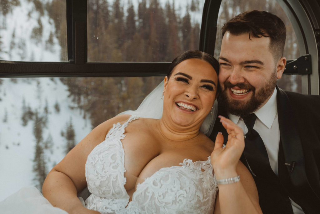 Bride and groom walking up the Banff Gondola to take portraits on Sulpher mountain for their winter adventure elopement.