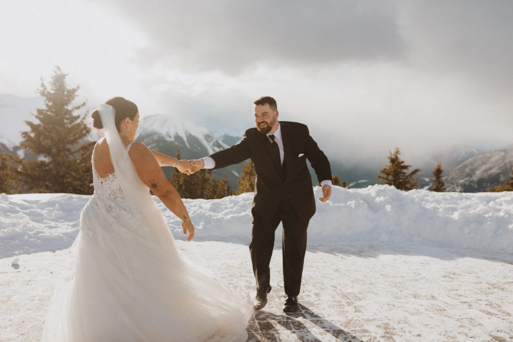 Bride and groom first dance on their Banff Gondola Elopement. They adventure and dance on top of sulphur mountain while listening to their song and soaking in the fact that they just got married in the beautiful rocky mountains.