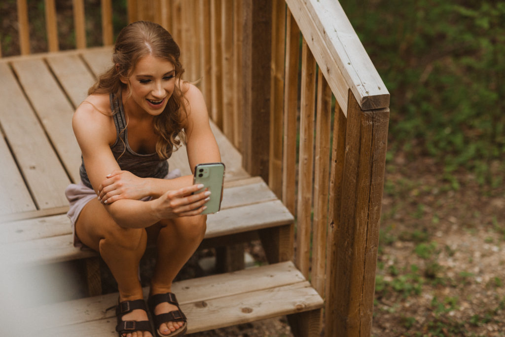 Bride finds ways to involve her parents in elopement day by facetiming them while getting ready in the morning before walking down the aisle.
