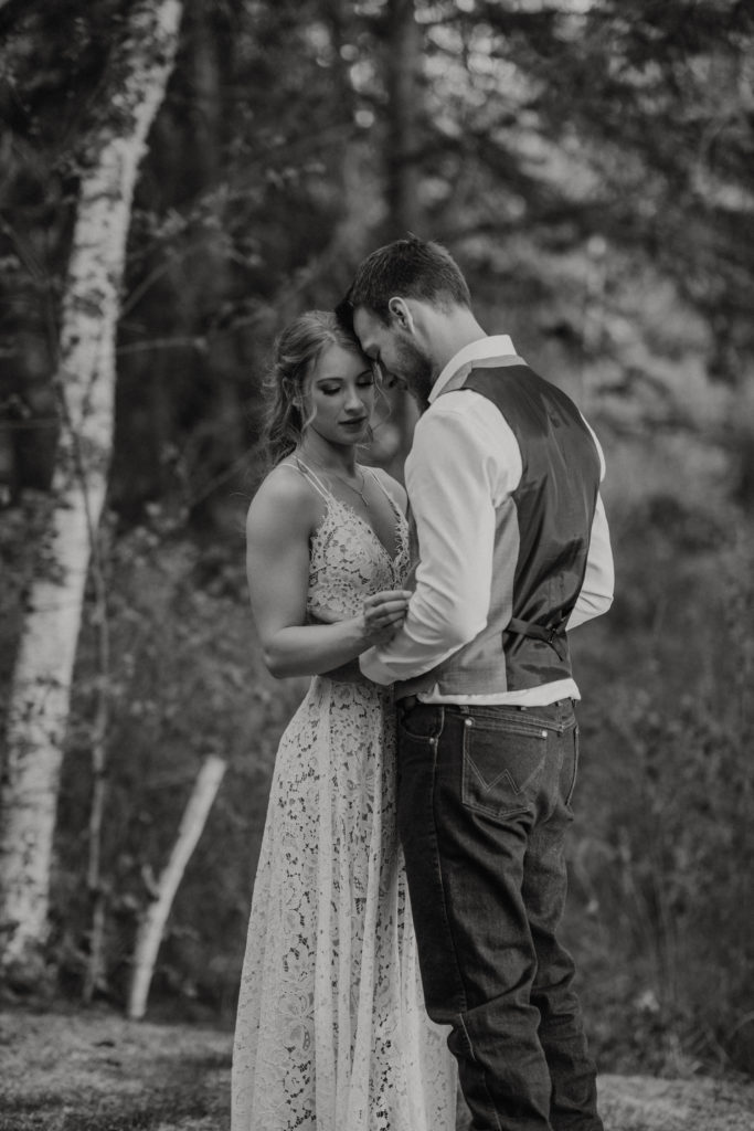 Bride and groom sitting in front of yurt. Couple portraits. Flora Bora Elopement in Northern Saskatchewan. Pictures by Liv Hettinga Photography, Saskatchewan Elopement Photographer.