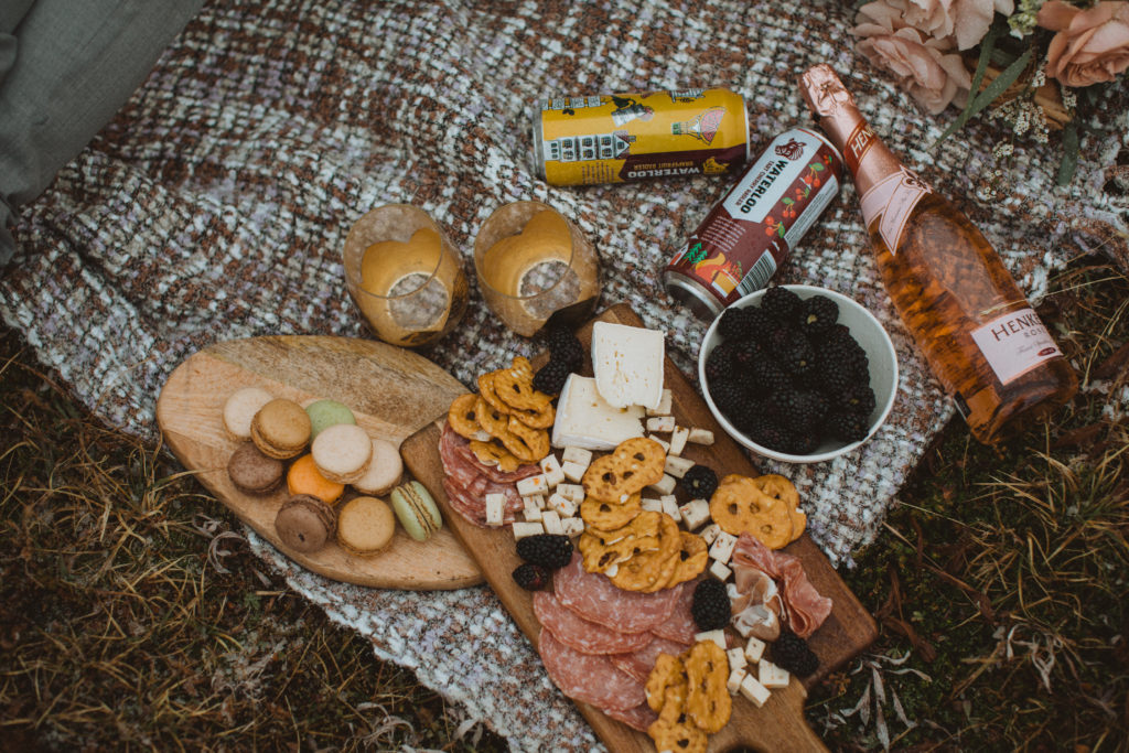 Charcuterie picnic and craft beer on elopement day hike
