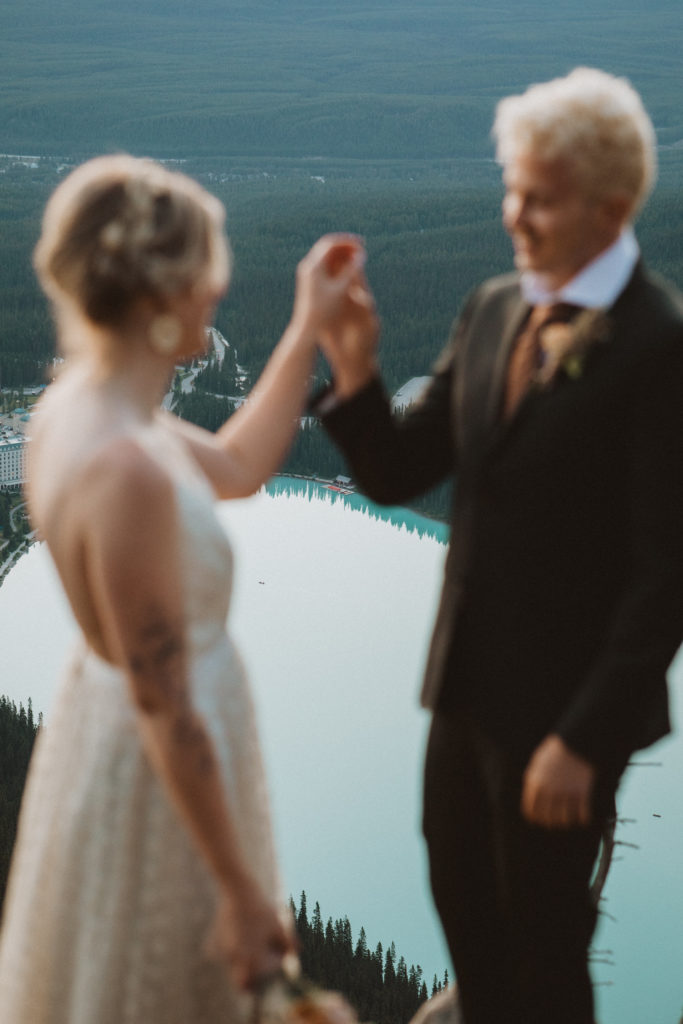 elopement photography overlooking lake louise in banff national park. Couple hiked to their elopement ceremony location