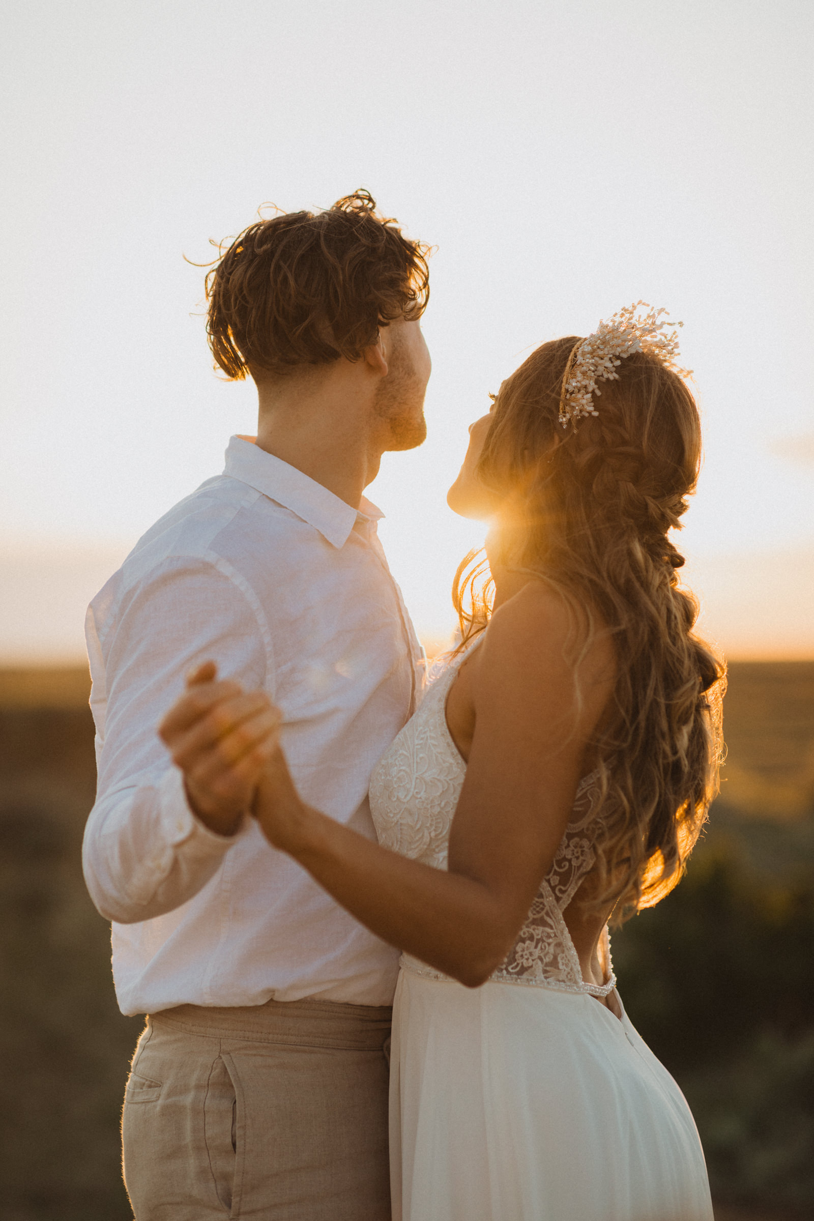 bride and groom first dance at golden hour