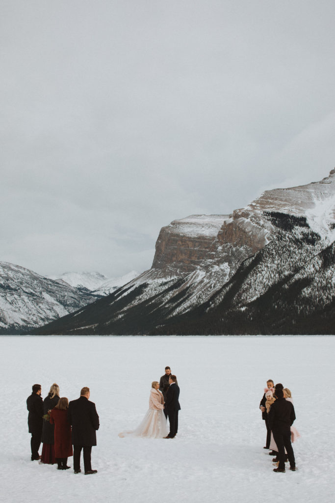 couple elope in the winter surrounded by their friends and family in banff national park