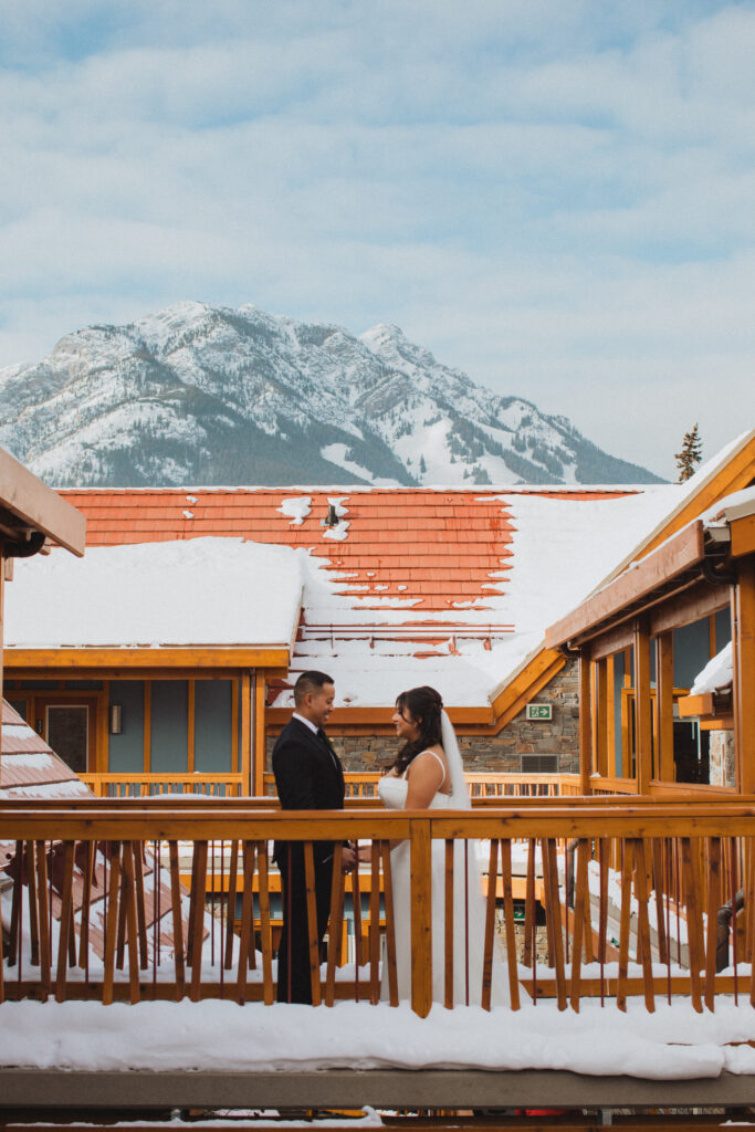 bride and groom first look outside airbnb in Alberta for elopement day
