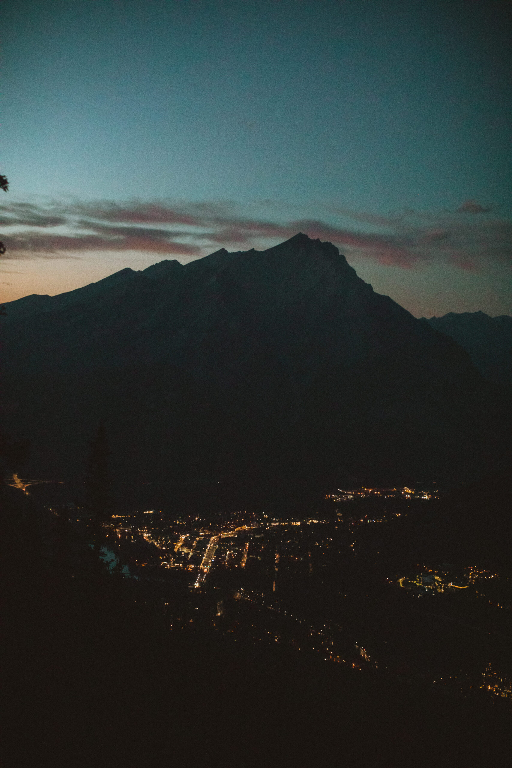 town of banff lit up at night, view from the banff gondola