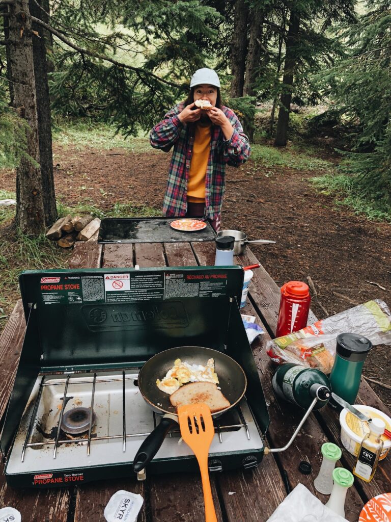 cooking breakfast at a campground in Banff