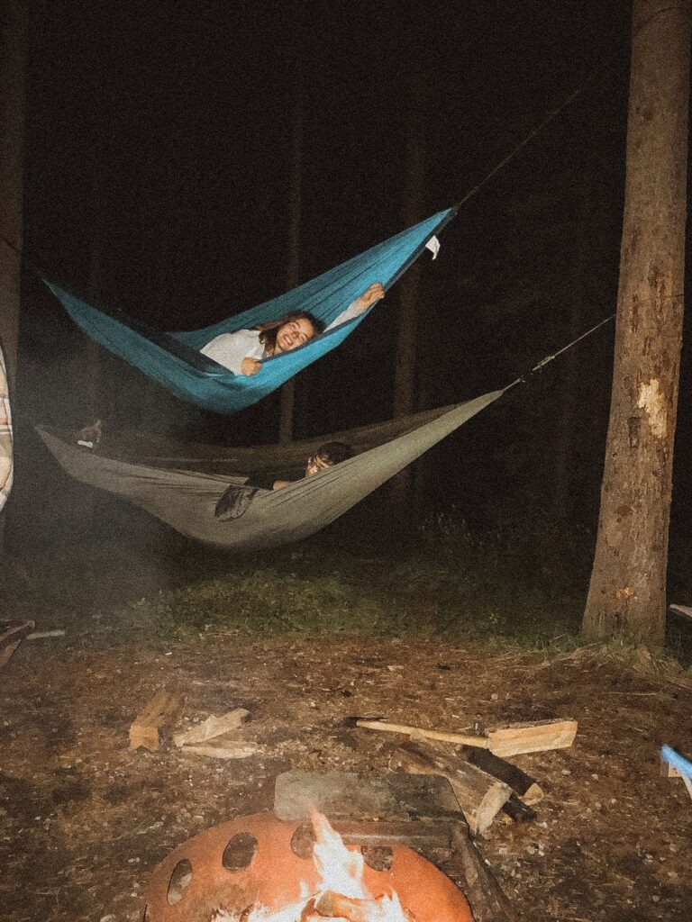 laying in hammocks while camping in Banff National park